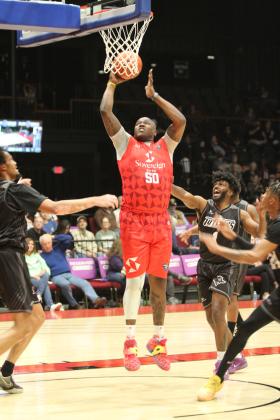 Potawatomi Fire Forward and Center Paul Harrison puts another two points in the bucket during the second quarter of the March 14 home game against the Enid Outlaws at FireLake Arena. The Fire triumphed, 150-94. Natasha Dunagan, Countywide &amp; Sun