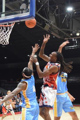 Fire Forward, Jay Hedgeman gets fouled at the bucket in the home opener against the Western Oklahoma Sky Kings Mar. 8.  The Potawatomi Fire dominated the game with a 116-81 win.
