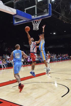 Fire Guard Deshawn Munson sinks the ball for two in the home opener against the Western Oklahoma Sky Kings, Mar. 8.  The Potawatomi Fire dominated the game with a 116-81 win.