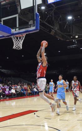 Isaiah Wade slams one in during the season opener of the Potawatomi Fire game, Mar. 8.  The Fire won 116-81 against the Western Oklahoma Sky Kings.