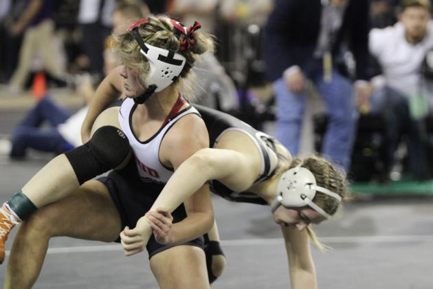 McLoud junior Addison Adams breaks out of a hold in the 140 weight division of the OSSAA Class 5A Girls Wrestling State Championship on March 1 at the State Fair Arena. The MHS girls wrestling team won first in the event. Countywide &amp; Sun/Natasha Dunagan