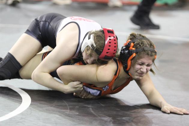 McLoud junior Launa Troutt puts the pressure on her opponent in the 115 weight division of the OSSAA Class 5A Girls Wrestling State Championship on March 1 at the State Fair Arena. Troutt was the second girls wrestling state champion at McLoud, after Carli Sisco, and their team took first in the state. Troutt also recently reached 100 career wins, according to the McLoud JH/HS Wrestling Facebook page. Countywide &amp; Sun/Natasha Dunagan