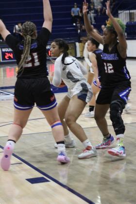 Shawnee sophomore Chrishelle Milum guards the ball against Memorial at the regional game at Shawnee on February 25th. The Lady Wolves won that game, 57-30, and on Feb. 28, they beat Pryor, 48-33. They advanced to play on March 4 against Coweta in Jenks. The Wolves played their regionals at Tulsa. They won their first game against Tahlequah, 65-61, and lost their second game, 48-53. They will play in the area tournament today (March 6) at 7 pm against Bishop Kelley in Sapulpa. Countywide &amp; Sun/Jessica Jones
