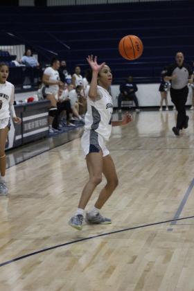 Shawnee junior Tarilyn Thierry passes the ball during the regional game on February 25th. The Lady Wolves won that game, 57-30, and on Feb. 28, they beat Pryor, 48-33. They advanced to play on March 4 against Coweta in Jenks. The Wolves played their regionals at Tulsa. They won their first game against Tahlequah, 65-61, and lost their second game, 48-53. They will play in the area tournament today (March 6) at 7 pm against Bishop Kelley in Sapulpa. Countywide &amp; Sun/Jessica Jones