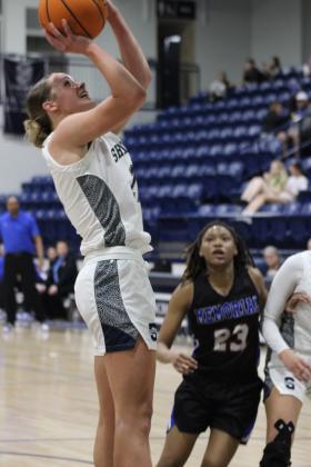 Shawnee senior Josie Megehee adds two points to the board during the Class 5A Regional home game against Memorial on Feb. 25. The Lady Wolves won that game, 57-30, and on Feb. 28, they beat Pryor, 48-33. They advanced to play on March 4 against Coweta in Jenks. The Wolves played their regionals at Tulsa. They won their first game against Tahlequah, 65-61, and lost their second game, 48-53.  They will play in the area tournament today (March 6) at 7 pm against Bishop Kelley in Sapulpa.