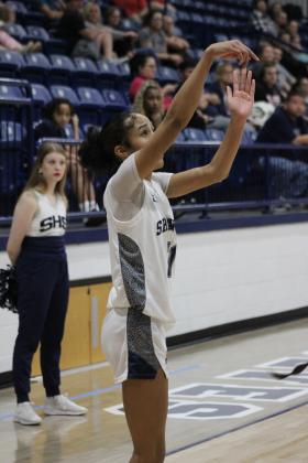 Shawnee junior Tarilyn Thierry sinks a three-pointer during the Class 5A Regional home game against Memorial on Feb. 25. The Lady Wolves won that game, 57-30, and on Feb. 28, they beat Pryor, 48-33. They advanced to play on March 4 against Coweta in Jenks. The Wolves played their regionals at Tulsa. They won their first game against Tahlequah, 65-61, and lost their second game, 48-53. They will play in the area tournament today (March 6) at 7 pm against Bishop Kelley in Sapulpa.