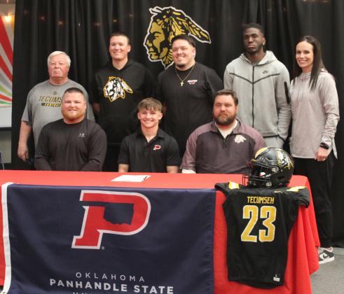 Tecumseh senior Zant Shirey signed a letter of intent for football with Oklahoma Panhandle State University in Goodwell on March 11. Shirey is shown with the football and baseball coaches. Seated, from left, is Head Baseball Coach Easton Marrs, Shirey, Head Football Coach Ty Bullock, back row, Billy Mitchell, Indy McNutt, Steven Huff, Josiah Wright and Athletic Director Casi Bays. Natasha Dunagan, Countywide &amp; Sun
