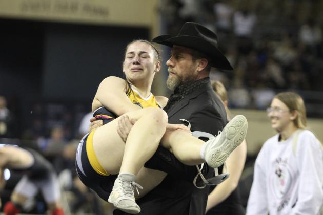 Tecumseh Wrestling Coach Billy Don Sigman carries senior Trinity Rakestraw from the mat after she hurt her knee during the OSSAA Class 5A Girls Wrestling State Championship on Mar. 1 at the State Fair Arena. Rakestraw lost the match but took runner-up in her weight division. She also reached 100 wins on Feb. 28. Countywide &amp; Sun/Natasha Dunagan