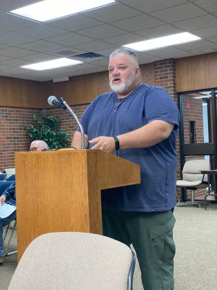 Code Enforcement Officer, James Smith, discusses safety concerns of a property on the agenda to be demolished. By Julie Talton, Countywide &amp; Sun