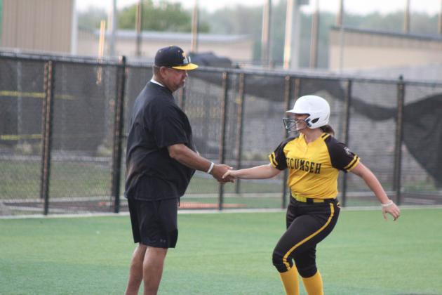 Tecumseh junior Maggie Wilson shakes hands with Head Coach Perry Wilson as she rounds third base after hitting a home run during the game against Shattuck in the Dale Slow Pitch Festival at FireLake Ball Fields on April 17. Over the two-day tournament, the Lady Savages sank Shattuck, 20-9; pushed past Pryor, 6-4; canceled Cache, 8-3; and, fell to Silo, 8-13. Natasha Dunagan, Countywide &amp; Sun