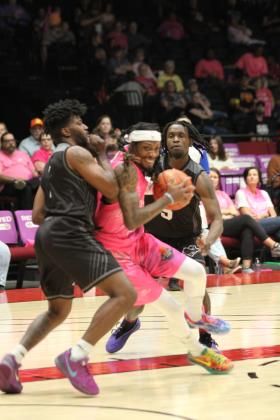 Potawatomi Fire Forward Ricky Artis II fights his way to the bucket during the April 10 Pink Out home game against the Enid Outlaws. The Fire won, 127-113. Natasha Dunagan, Countywide &amp; Sun
