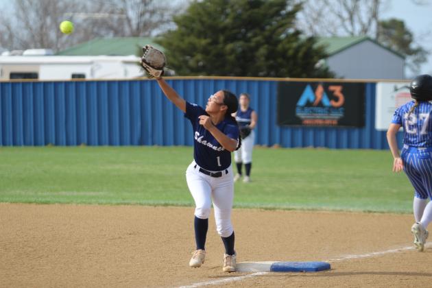 Shawnee's Jocelyn Hayes prepares for the catch at first, but Bethel's Frost Peltier has already crossed it during the slow pitch game at Bethel on March 27. Natasha Dunagan, Countywide &amp; Sun