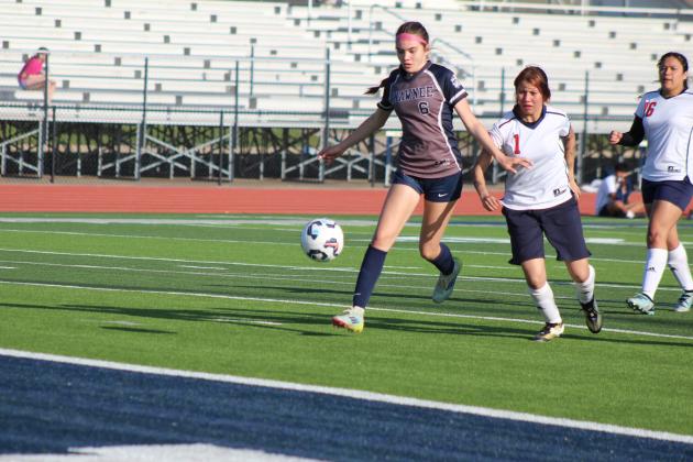 Shawnee freshman Gemma LaPlant gets the ball to the goal, but her shot is stopped by the goalie. Natasha Dunagan, Countywide &amp; Sun