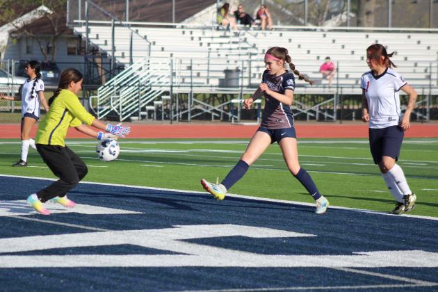 Shawnee freshman Gemma LaPlant gets the ball to the goal, but her shot is stopped by the goalie. Natasha Dunagan, Countywide &amp; Sun