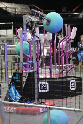 Sapphira, the robot designed and built by the Blue Phoenix team from Shawnee, carries a ball to "the reef," where it would lift it into a high trough during the Oklahoma Regionals FIRST Robotics Competition, held at FireLake Arena on April 5. Natasha Dunagan, Countywide &amp; Sun