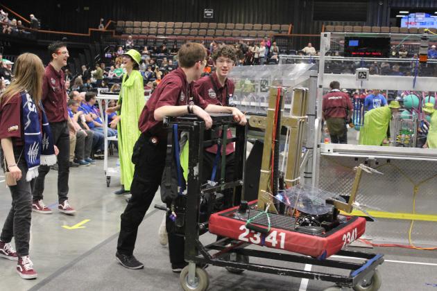 Gordon Cooper Technology Center's Sprockets Robotics Team escorts their robot, formerly "The Trench," but renamed "Tsunamic," to the pit area during the Oklahoma Regionals FIRST Robotics Competition on April 5 at FireLake Arena. Sprockets made it through the two rounds of Finals and were on the winning alliance. They also won the Regional Engineering Inspiration Award. Natasha Dunagan, Countywide &amp; Sun