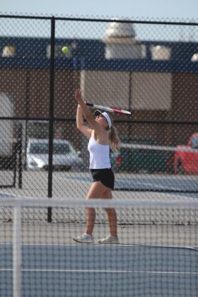 Shawnee sophomore Masei Hope serves on #2 Doubles with junior Anndrea Parada during the East/West Quad Tournament on March 25. Natasha Dunagan, Countywide &amp; Sun