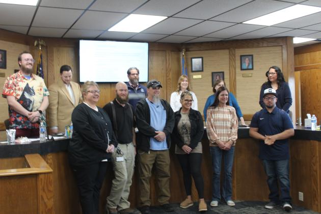 The Shawnee Public Schools Board of Education stands behind the Support Employees of the Year who were introduced during the April 7 meeting. They are, from left, Kristy Kellogg, Tom Wondrock, Adam Aloway, Letty Alvaredo, Cathleen Garnand and Sean Compton. Natasha Dunagan, Countywide &amp; Sun
