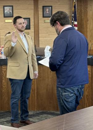 Newly-elected Shawnee Public Schools Board of Education member Casey White is sworn in by Board President Clif Harden during the April 7 meeting. Serving Ward 7, White replaces Bobby Canty who will be honored at the May 5 meeting at 6 pm. Photo provided by Allyson Cleveland