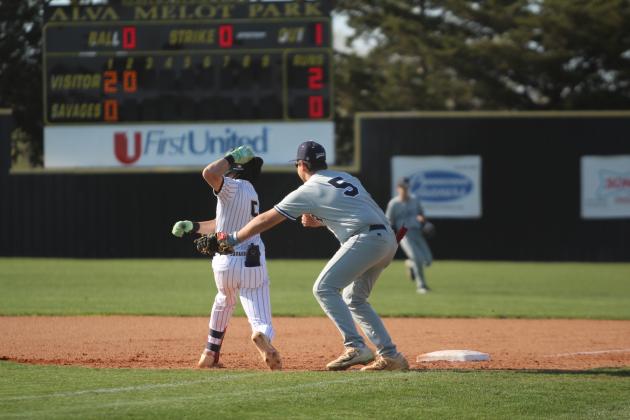 Tecumseh senior Lane Steward zig-zags to avoid being tagged by the Asher first-baseman in the second inning of the game at Tecumseh on April 7. The Savages lost, 5-9. Natasha Dunagan, Countywide &amp; Sun