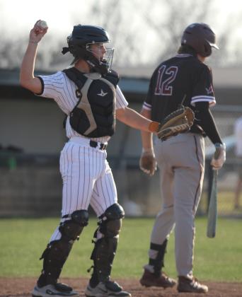 Tecumseh sophomore Kruz Shirey throws to the pitcher during the March 25 home game with Blanchard. The Savages fell, 0-11. Natasha Dunagan, Countywide &amp; Sun
