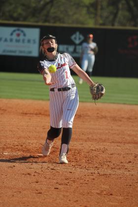 McLoud's Avery Soward lofts the ball toward home in the game at Tecumseh against the Lady Savages on April 7. The Lady Redskins lost, 1-9, and later fell to Dale, 1-18. Natasha Dunagan, Countywide &amp; Sun
