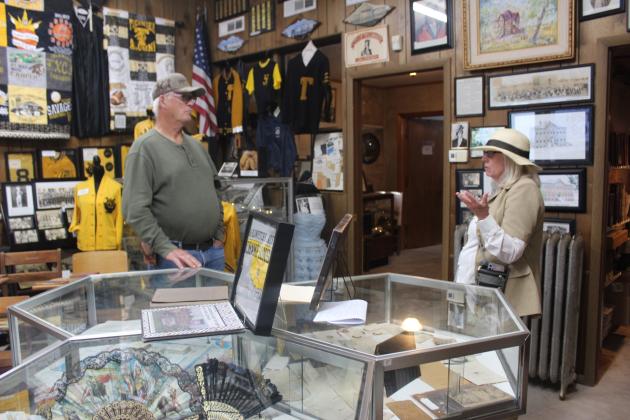 Tecumseh Museum volunteer Arthenia Haney, right, talks with former Tecumseh city employee Jerry Yates while standing in the school collection area during the museum's 30th anniversary on April 19. Natasha Dunagan, Countywide &amp; Sun