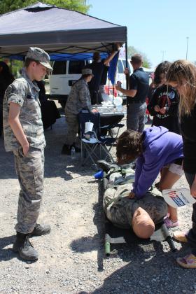 Gordon Cooper Technology Center Composite Squadron member Keagan Hillman, 14, of Prague, teaches Lily Zuaznabar, 9, of Dale, to perform CPR during the Touch A Truck and Beyond event, held at the Citizen Potawatomi Nation Festival Grounds on April 12.