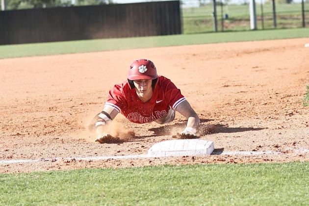 North Rock Creek's Landon Rosser slides safe into third. The Cougars took on Perkins-Tryon, winning their first district championship while celebrating senior night. Photo courtesy of Gowin Photography