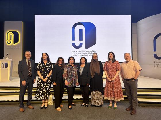 Speakers at the first American Library Association Sharjah School Librarians Conference pose in front of the stage at the Expo Centre Sharjah in the United Arab Emirates last month.