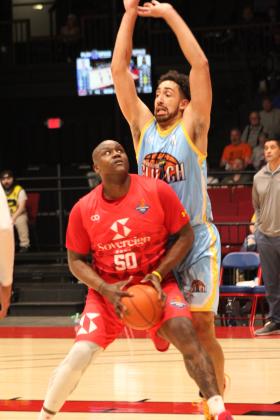 Potawatomi Fire Forward/Center Paul Harrison eyes the basket around a San Antonio Clutch Defender during the Central Conference home game on May 2. Harrison added 14 points and 7 rebounds. After beating the Clutch, 138-81, the Fire stands at 44 straight wins inside FireLake Arena, according to potawatomifire.com. Their next home games will be tomorrow (May 9) against Little Rock and May 10 against Enid, both at 7 pm.