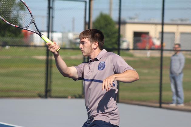 Shawnee junior Benji Cole, on #1 Doubles with junior Bryce Comstock, makes a forehand stroke during the Shawnee NGB (National Governing Body) Tournament on May 3. They were playing against Tecumseh. The boys competed that day, but the girls tournament on May 2 was canceled due to rain.