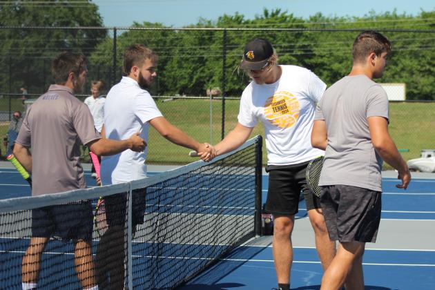 The Shawnee #1 Doubles team of Benji Cole and Bryce Comstock, left of net, shake hands with the Tecumseh #1 Doubles team of Ted Belshe and Noah Henson during the Shawnee NGB (National Governing Body) Tournament on May 3.