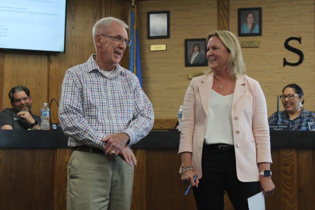 Bobby Canty and Dr. Teresa Wilkerson have a laugh while telling stories during the May 5 Shawnee Board of Education meeting. Both Canty and Wilkerson are retiring - Canty after 12 years on the Board and Wilkerson after 38 years in education, six of those in Shawnee. Natasha Dunagan, Countywide &amp; Sun