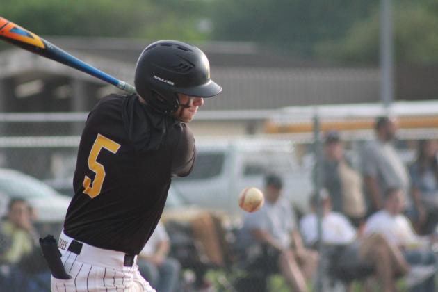 Tecumseh senior Lane Steward gets a walk after getting hit by the ball in the seventh inning of the Senior Night home game against Chandler on April 28. The Savages won, 11-9, in their last regular season game.