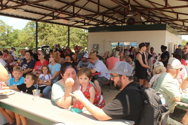 The McLoud Chamber of Commerce pavilion was a popular location during the Blackberry Festival on June 21. They sold just under 3,000 quarts of fresh blackberries and 2,500 jars of blackberry jam, said Melanie Krause with the Chamber.