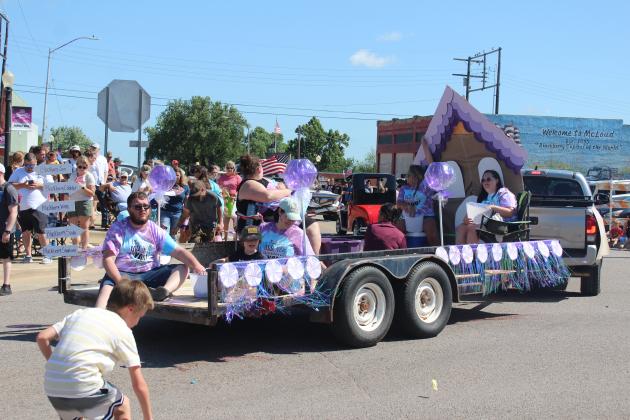 The McLoud BancFirst float - with Michael and Stephanie Bickel, Hailey Broga, Gemini Eason and Anna Billins - participates in the Blackberry Festival Parade on June 21. There were 75-80 entries in the parade, said Melanie Krause with the McLoud Chamber of Commerce.