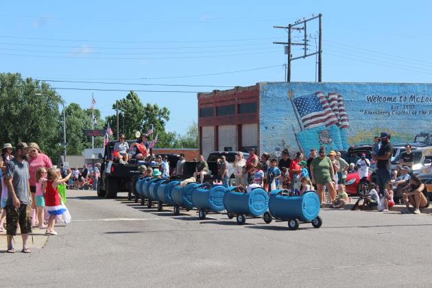 A barrel train full of kids and stuffed toys was the McLoud Blackberry Festival Parade entry for American Auction Service on June 21.