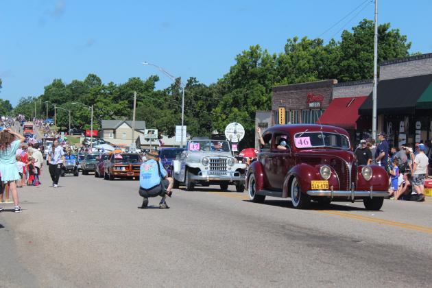 The India Shrine Old Wheels Unit, led by Rick Brown in a 1948 Ford, rolls east on Broadway Ave. in the McLoud Blackberry Festival Parade on June 21. They won second out of the 75-80 entries, behind McLoud First Baptist Church in first, said Melanie Krause with the McLoud Chamber of Commerce.