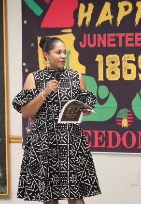 Dunbar Heights Community Group Vice President Sha'kiya Morris serves as the master of ceremonies during the Juneteenth celebration held at Shawnee Community Center on June 17.