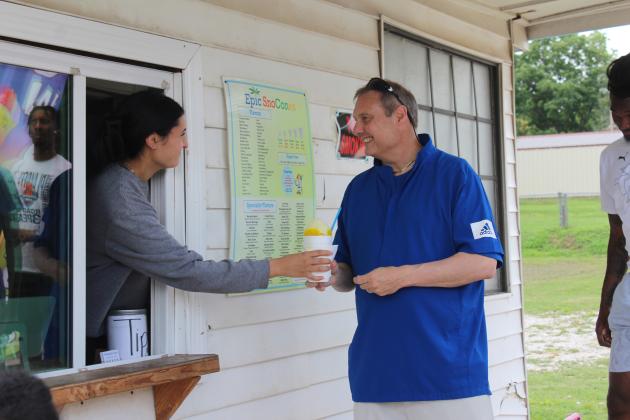 Potawatomi Fire Head Coach Mark Dannhoff gets a snow cone and a smile from Daley Rice at Epic Snocones during their Juneteenth celebration on June 19. Business owner David Henry invited the Potawatomi Fire team and also had a bounce-house for the kids. Natasha Dunagan, Countywide &amp; Sun