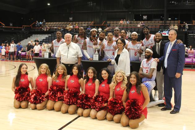 The Potawatomi Fire, their coaches Mark Dannhoff and Emmanuel Toney, the Fire Girls and Citizen Potawatomi Chairman John "Rocky" Barrett and  Vice Chair Linda Capps pose with their latest Western Regional Championship trophy after beating the Great Falls Electric on June 15. Natasha Dunagan, Countywide &amp; Sun
