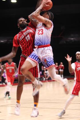 Potawatomi Fire Forward Isaiah Wade goes up for his shot on June 5, in the first game of the Midwest Conference Finals against the Logansport Iron Horses at FireLake Arena. The Fire won that game, 160-90, and the second game on June 7, 134-109, to take the trophy. They will move on to the Western Regional Finals against Great Falls Electric, June 12 (away) and June 15 (FireLake Arena). Natasha Dunagan, Countywide &amp; Sun