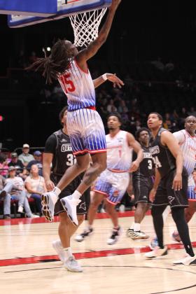 Potawatomi Fire Forward Jay Hedgeman makes a layup during the first quarter of the Central Division Finals Game 2. The Fire beat the Enid Outlaws, 157-89, in this game and in the first game at Enid, 122-98. They move on to the Midwest Conference Finals today (June 5) and June 7, both days at 7 pm at FireLake Arena, according to potawatomifire.com.