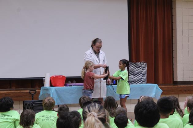 Dr. Arthropod and two helpers use heat-sensitive paper to make art.