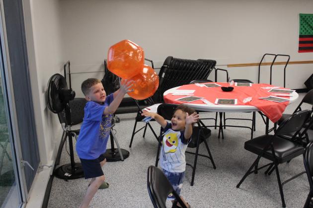 Children play together at the Dunbar Heights Juneteenth celebration.