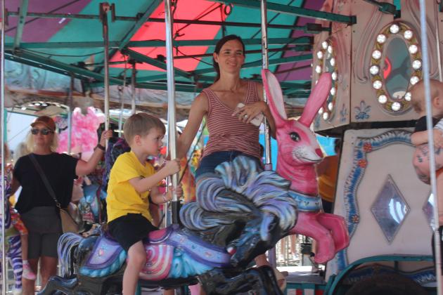 Children enjoy the carousel.