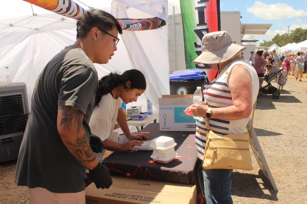 Tyler Nguyen &amp; Kyrie Soto with Barbells &amp; BBQ sell blackberry cobbler.