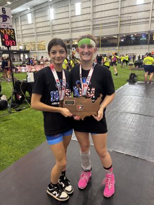 Team Oklahoma members Lizzy Palma-Hernandez and Kylei Gokey, both of Tecumseh, pose in their individual medals and with the fourth-place Greco-Roman wrestling team plaque in Westfield, IN, on June 21 for the 16U Women's National Duals. (Gokey wore the headband to cover a skin wound.) Photo provided