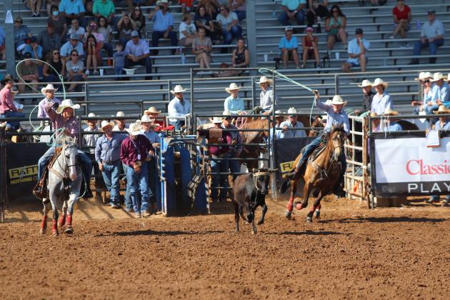 Braxton Ogle of McLoud, left, and Colton Thomason of Henryetta compete in team roping in the second go-round at the IFYR on the morning of July 10.